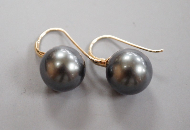 A modern pair of 585 yellow metal and Tahitian style South Sea pearl earrings, diameter approx. 11.8mm and 12.1mm, gross weight 5.9 grams.